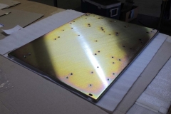 Sheet Metal With Nuts On It | Guzman Manufacturing