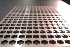 Sheet Metal With Hexagons Cut Out | Guzman Manufacturing