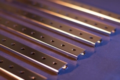 Six Metal Bars With Holes In Them | Guzman Manufacturing