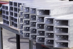 Stack Of Rectangular Metal Bars | Guzman Manufacturing